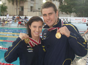 ellen fullerton and ryan napolian with gold medals photo hmg.jpg